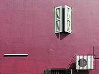 red wall, airco and window